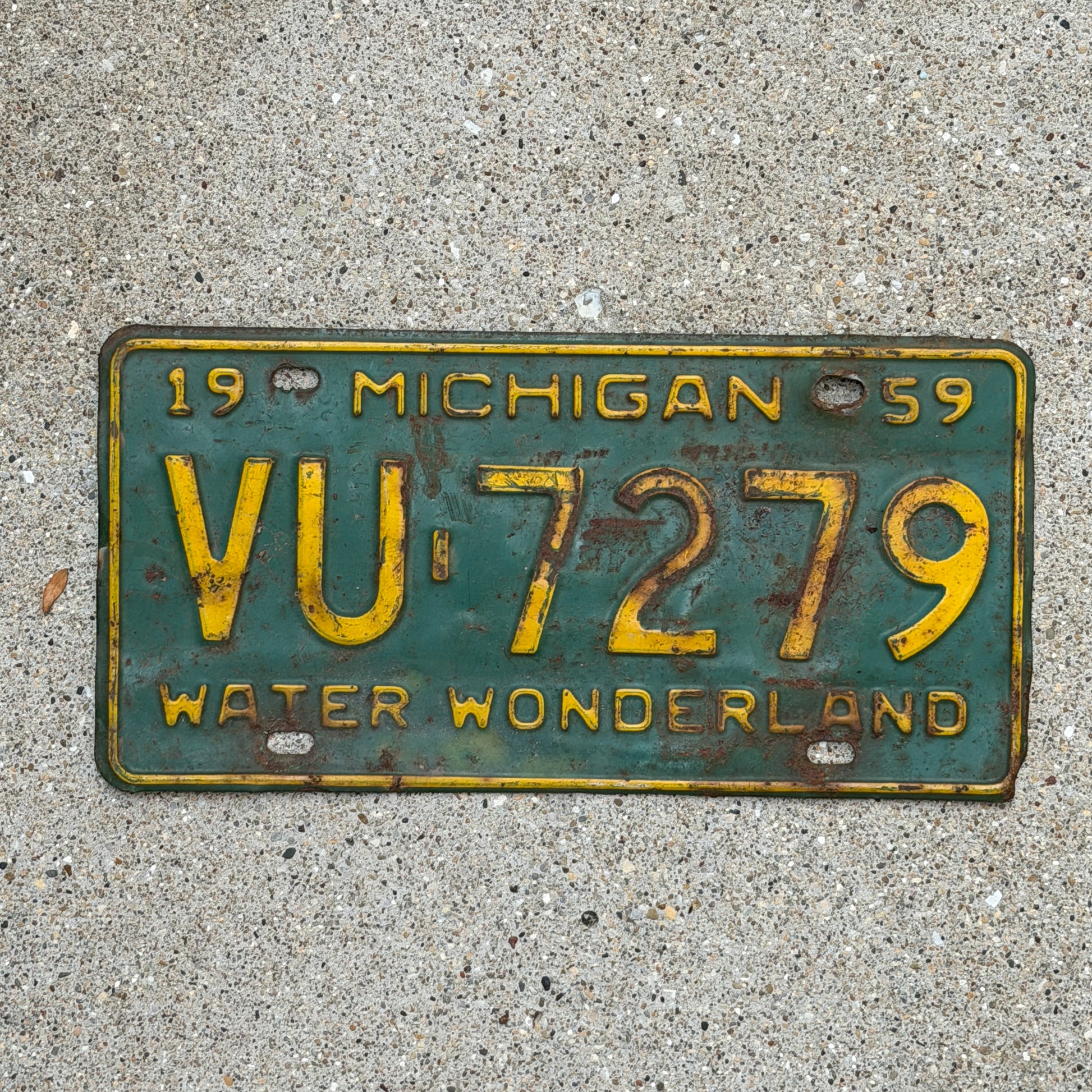 Photo of a 1959 Michigan License Plate Auto Tag Garage Decor Vintage VU 7279 with original patina