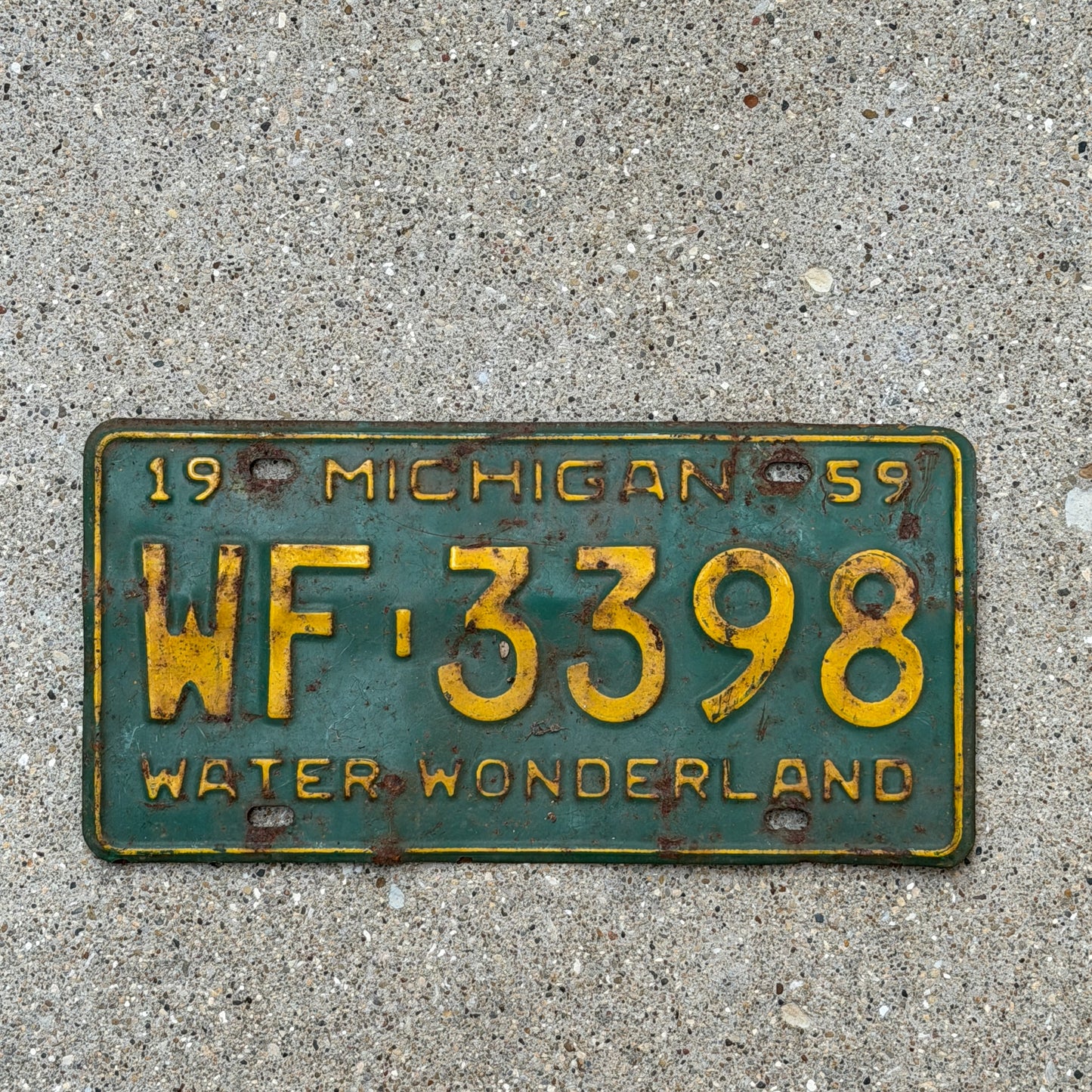 Photo of a 1959 Michigan License Plate Auto Tag Garage Decor Vintage WF 3398 with original patina