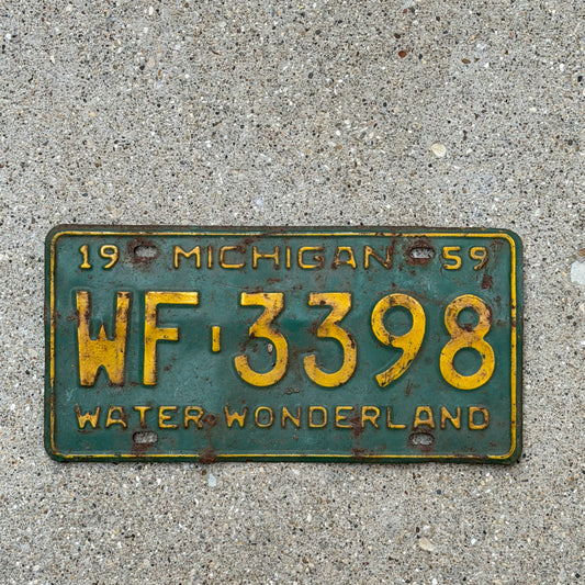 Photo of a 1959 Michigan License Plate Auto Tag Garage Decor Vintage WF 3398 with original patina