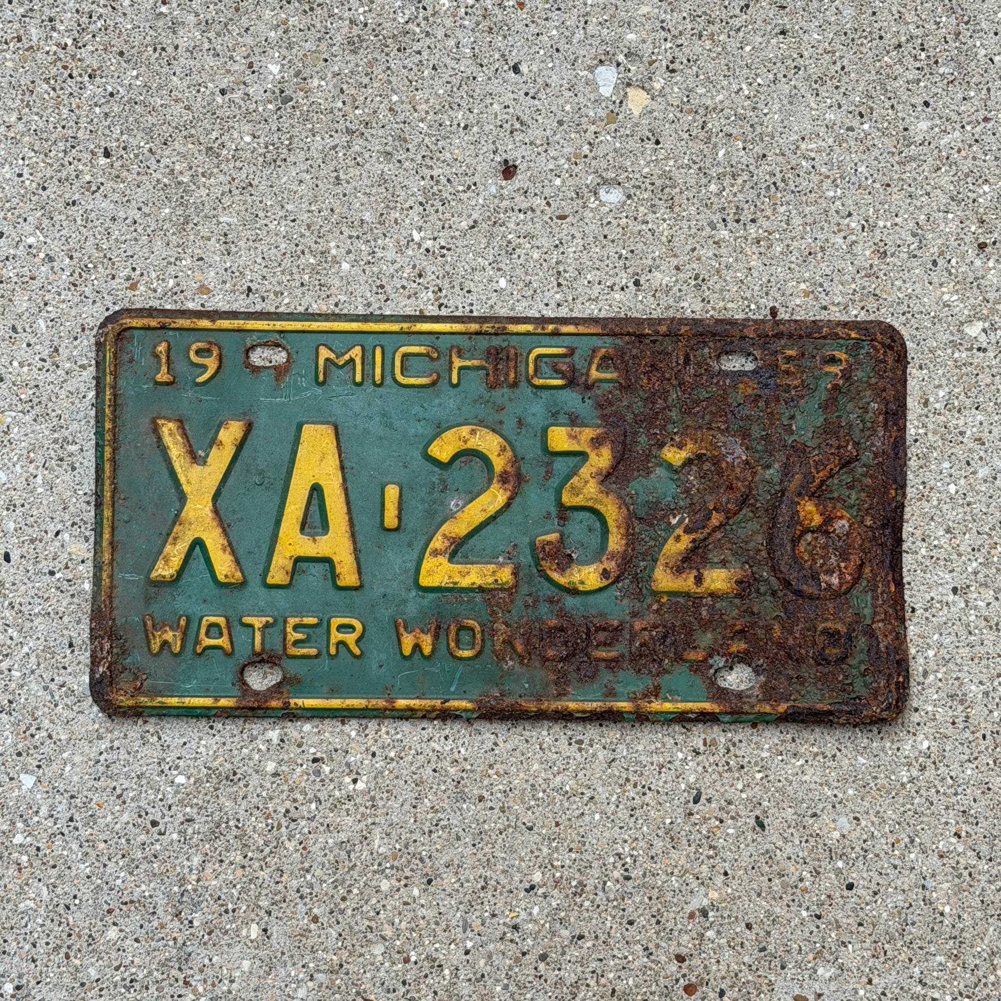 Photo of a 1959 Michigan License Plate Auto Tag Garage Decor Vintage XA 2326 with original patina