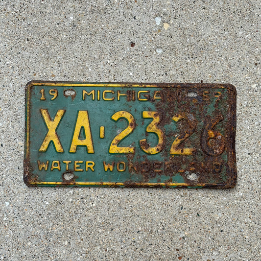 Photo of a 1959 Michigan License Plate Auto Tag Garage Decor Vintage XA 2326 with original patina