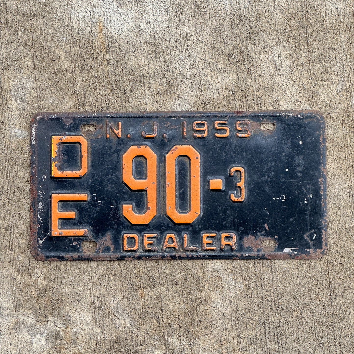 Photo of a 1959 New Jersey Dealer License Plate Auto Tag Garage Decor Vintage DE 90 3 with original patina