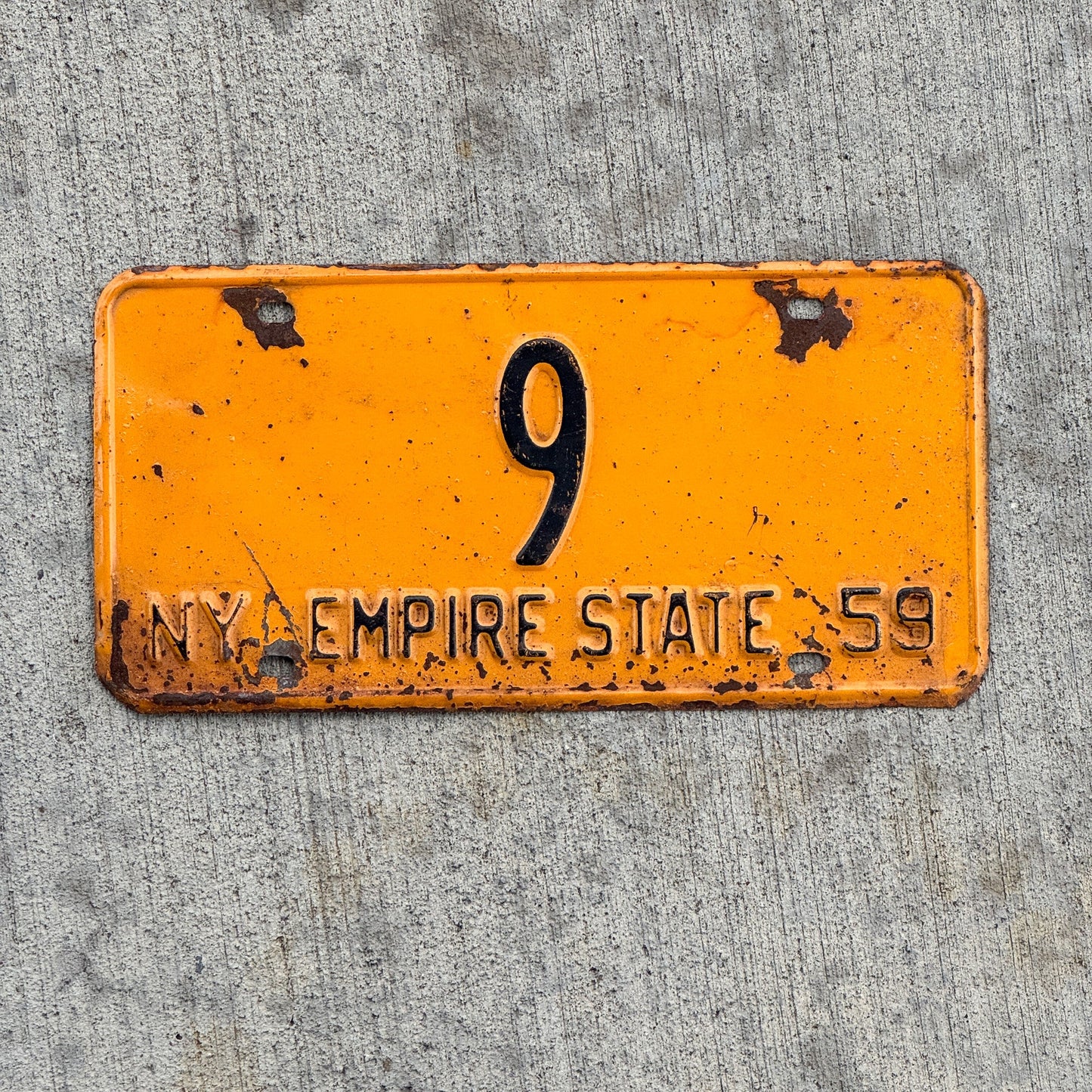 Photo of a 1959 New York Reserved License Plate Auto Tag Garage Decor Vintage Low Number Single Digit 9 with original patina