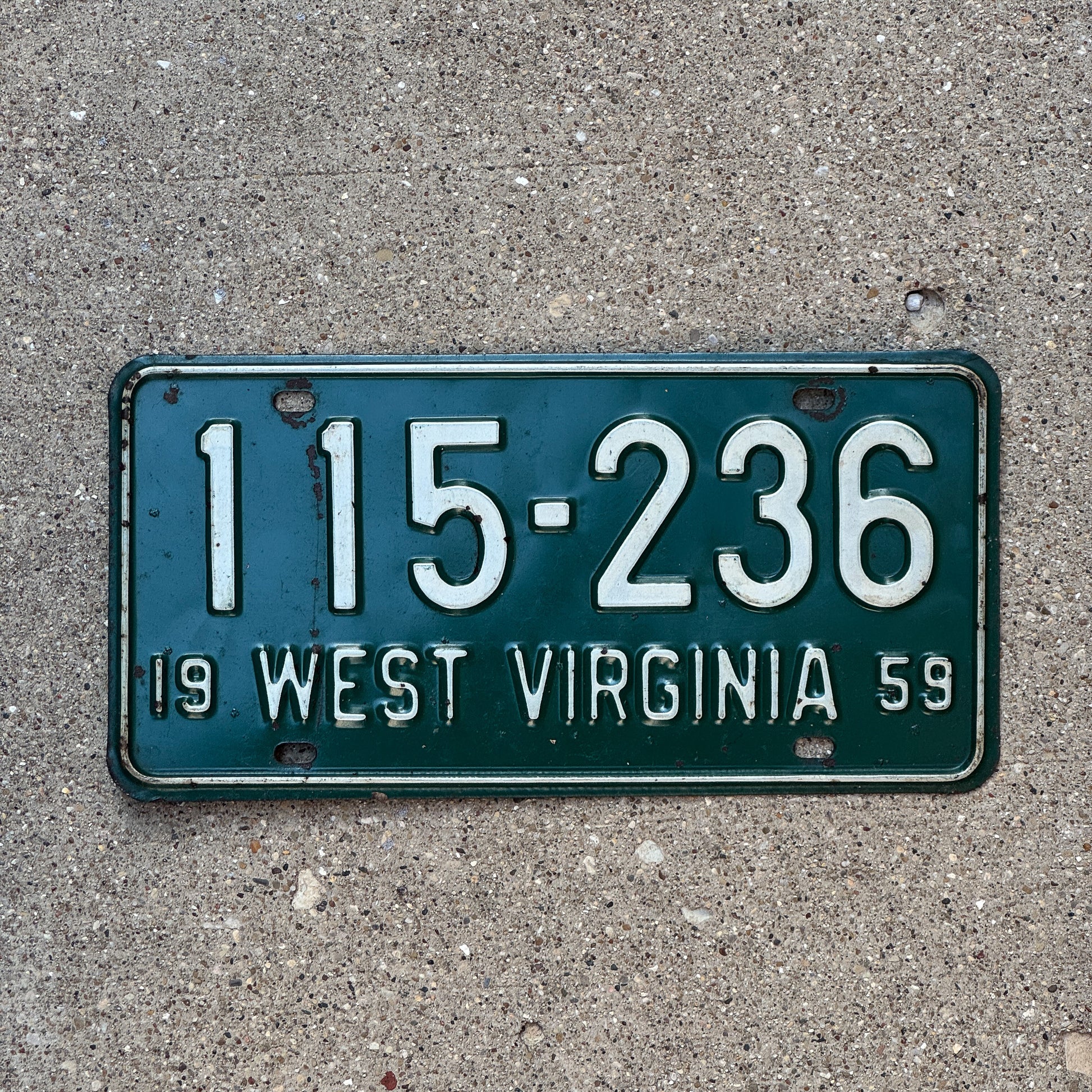 Photo of a 1959 West Virginia License Plate Auto Tag Garage Decor Vintage 115 236 with original patina