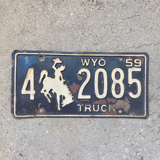 Photo of a 1959 Wyoming Truck License Plate Auto Tag Garage Decor Vintage Cowboy Rodeo Weed Smoking 4 2085 with original patina