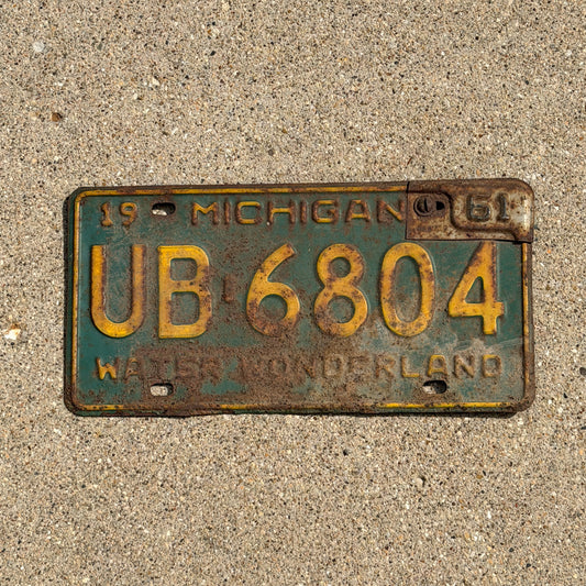 Photo of a 1960 1961 Michigan License Plate Auto Tag Garage Decor Vintage UB 6804 with original patina
