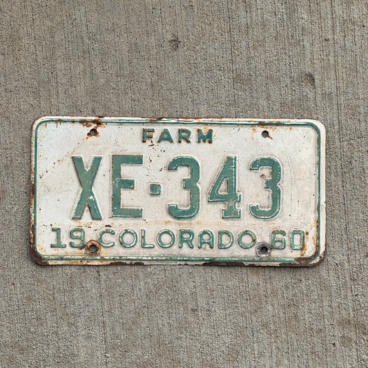 Photo of a 1960 Colorado Farm Truck License Plate Auto Tag 1 Vintage Garage XE 343 with original patina