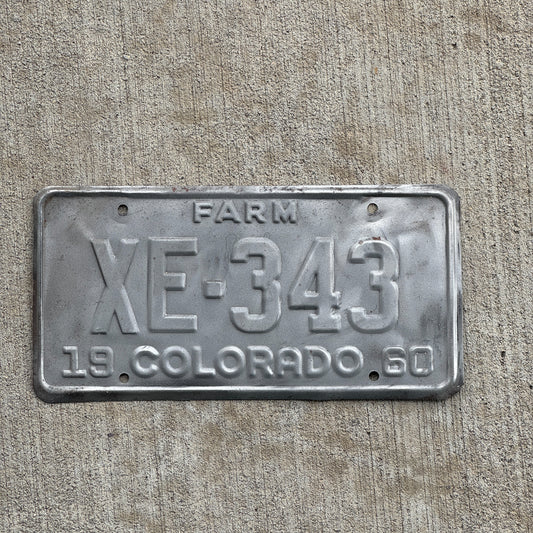 Photo of a 1960 Colorado Farm Truck License Plate Auto Tag 2 Vintage Garage XE 343 with original patina