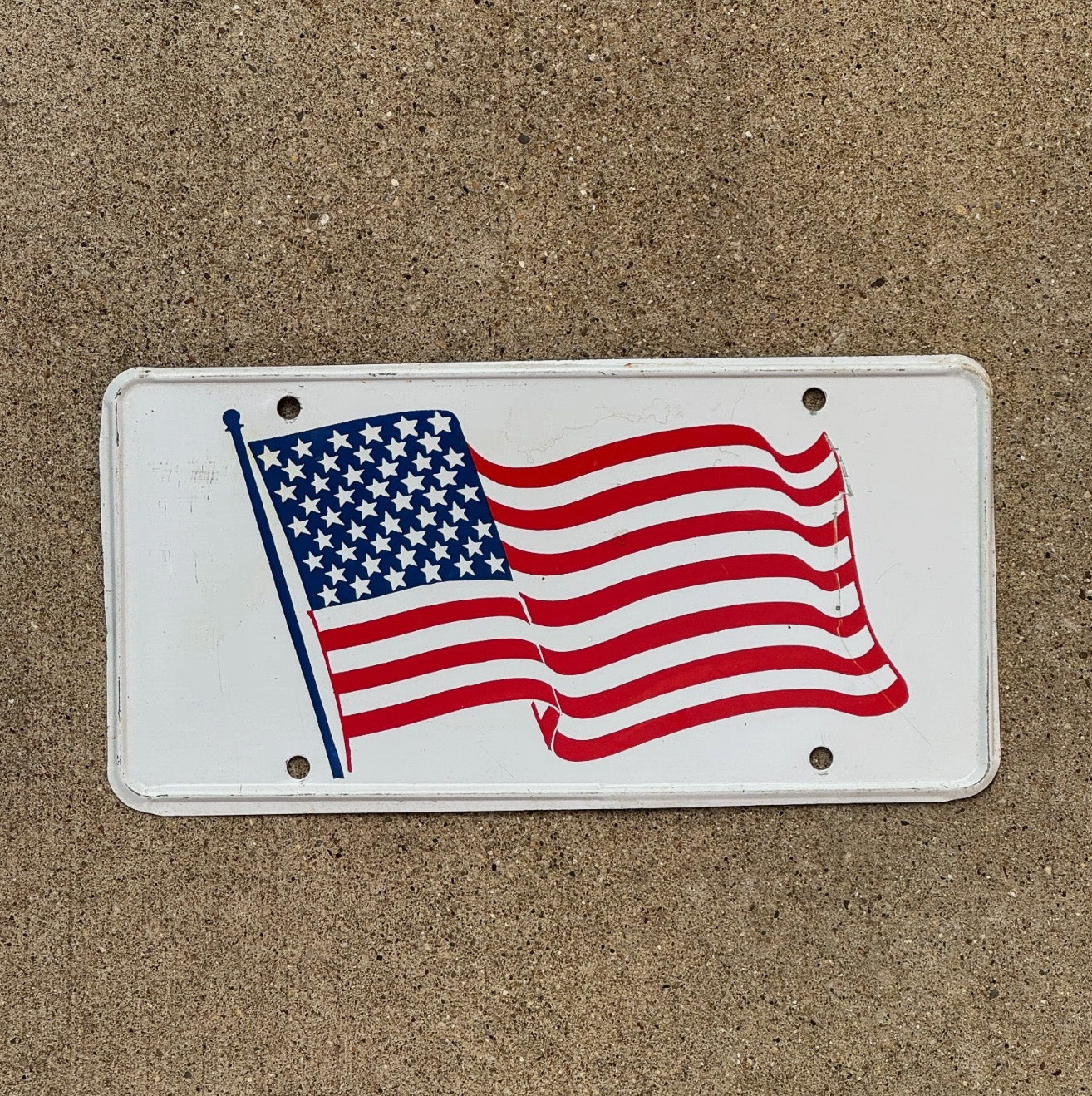 Photo of a 1960 Era American Flag Booster License Plate Auto Tag Garage Decor Vintage USA Patriotic America United States American Flag with original patina