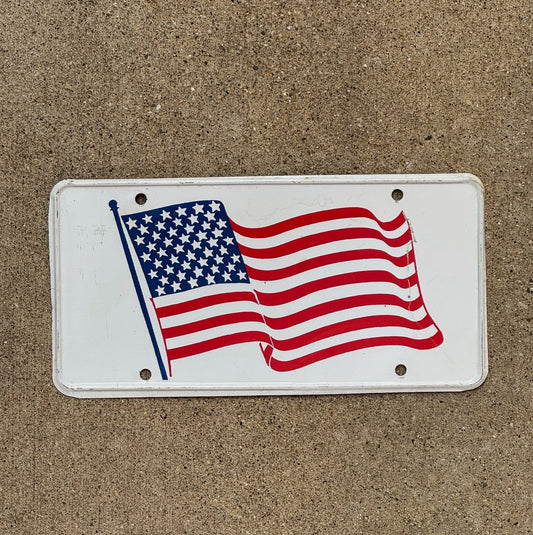 Photo of a 1960 Era American Flag Booster License Plate Auto Tag Garage Decor Vintage USA Patriotic America United States American Flag with original patina