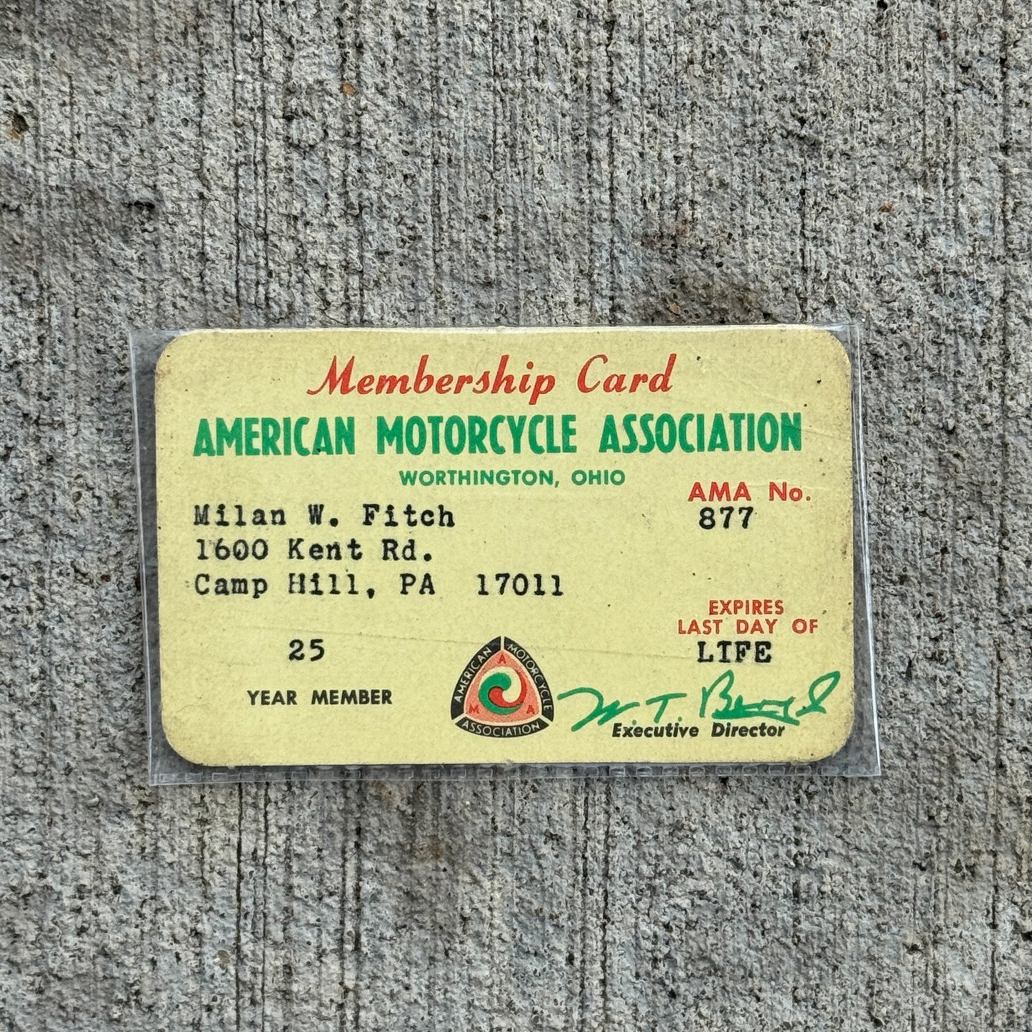 Photo of a 1960 Era American Motorcycle Association Card Worthington Ohio Auto Tag Garage Decor Vintage AMA No 877 Milan Fitch with original patina