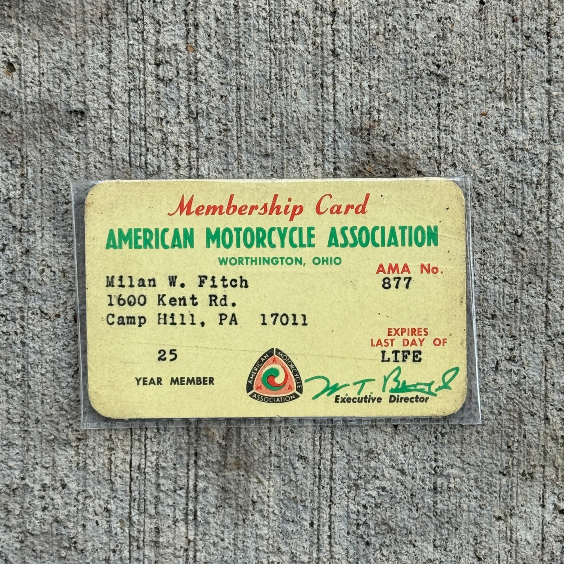 Photo of a 1960 Era American Motorcycle Association Card Worthington Ohio Auto Tag Garage Decor Vintage AMA No 877 Milan Fitch with original patina