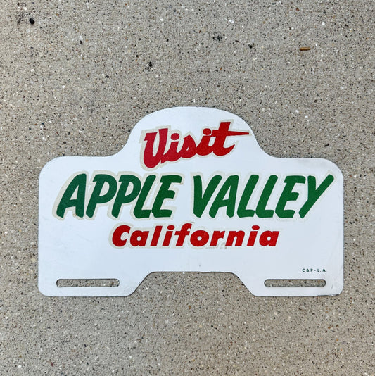 Photo of a 1960 Era Apple Valley California License Plate Topper Auto Tag Garage Decor Vintage Smaltz Paint Los Angeles Area with original patina