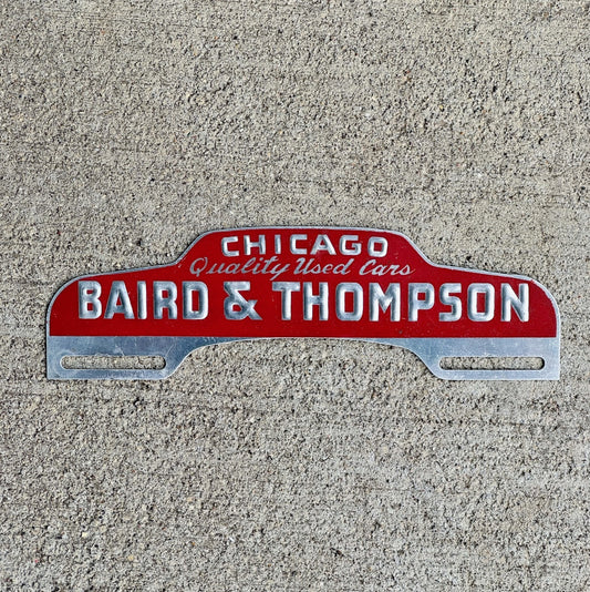 Photo of a 1960 Era Baird Thompson Chicago Illinois License Plate Topper Auto Tag Garage Decor Vintage Used Car Dealer Illinois with original patina