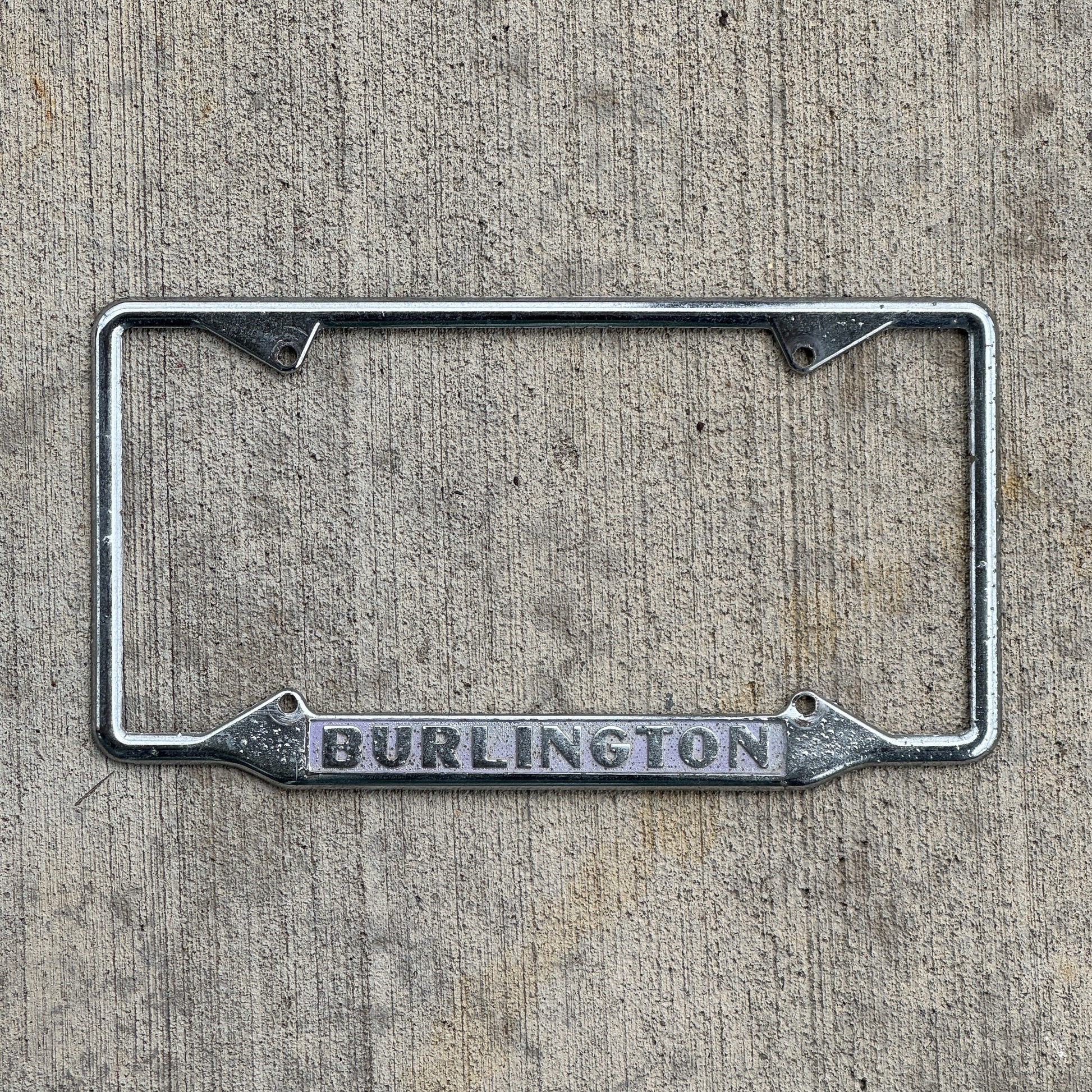 Photo of a 1960 Era Burlington License Plate Frame Auto Tag Garage Decor Vintage with original patina