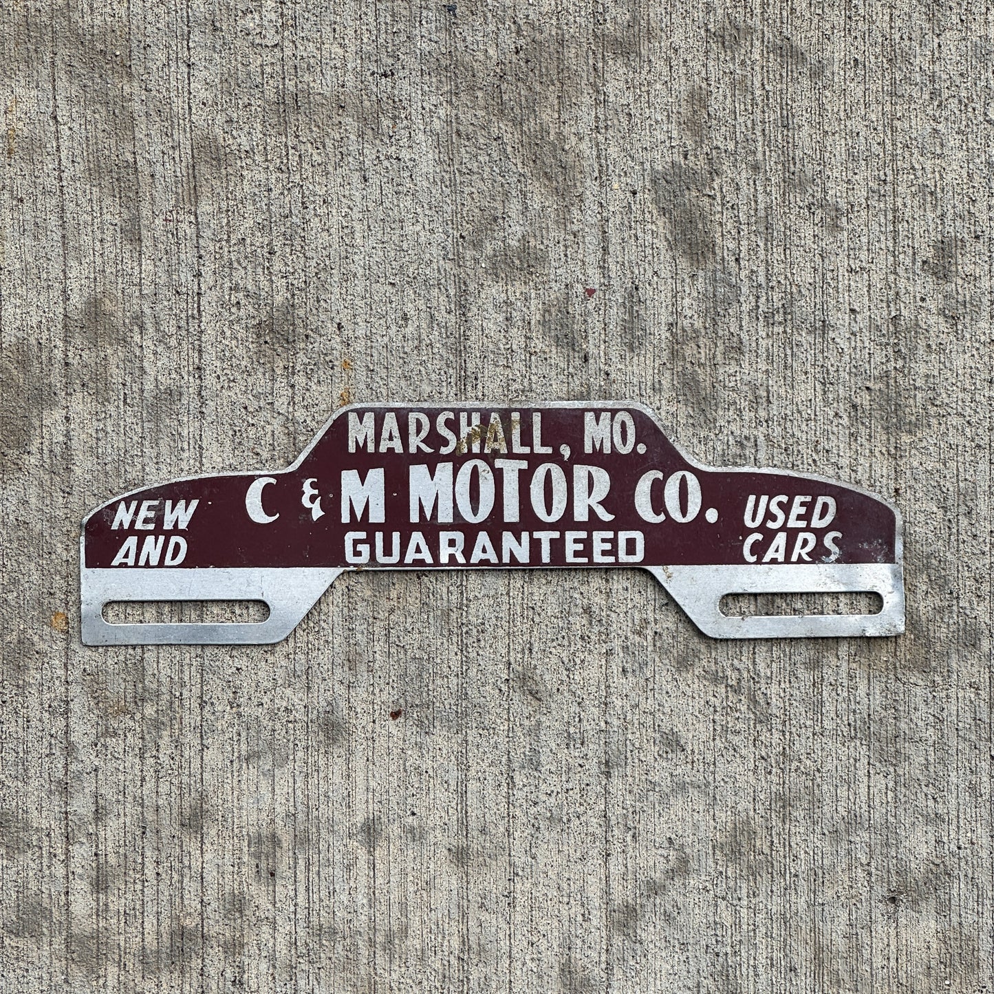 Photo of a 1960 Era C & M Motor Co Marshall Missouri License Plate Topper Auto Tag Garage Decor Vintage with original patina