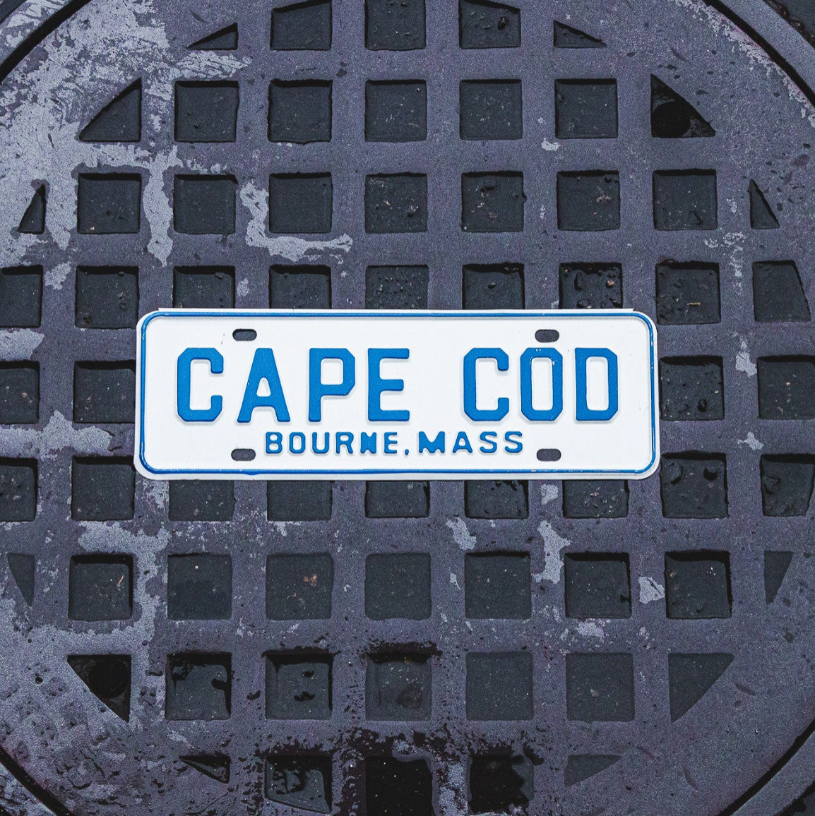 Photo of a 1960 Era Cape Cod Bourne Massachusetts License Plate Topper Auto Tag Garage Decor Vintage with original patina