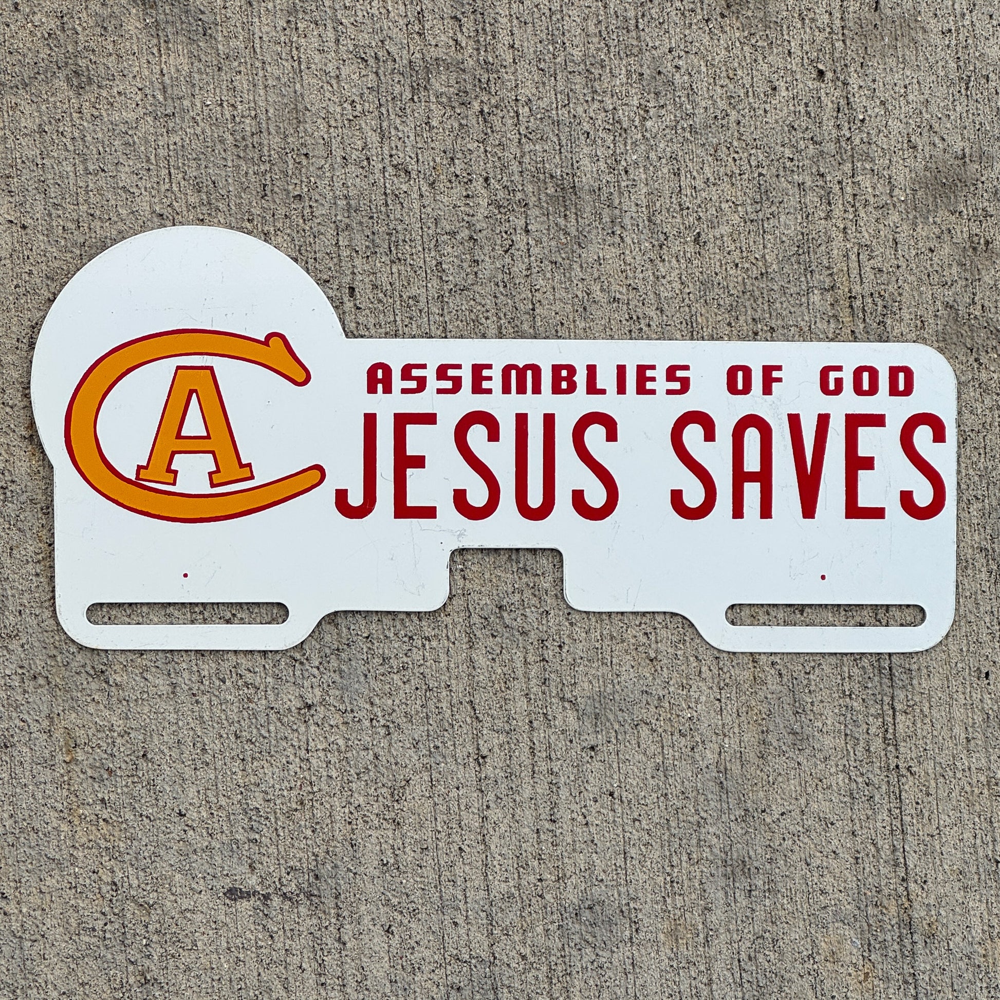 Photo of a 1960 Era Christ for All Assembies of God License Plate Topper Auto Tag Garage Decor Vintage Jesus Saves with original patina