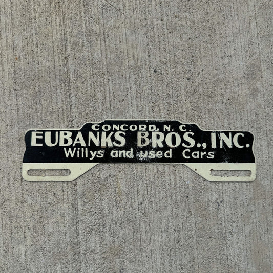 Photo of a 1960 Era Concord North Carolina License Plate Topper Auto Tag Garage Decor Vintage Willys Jeep Dealer Eubanks with original patina