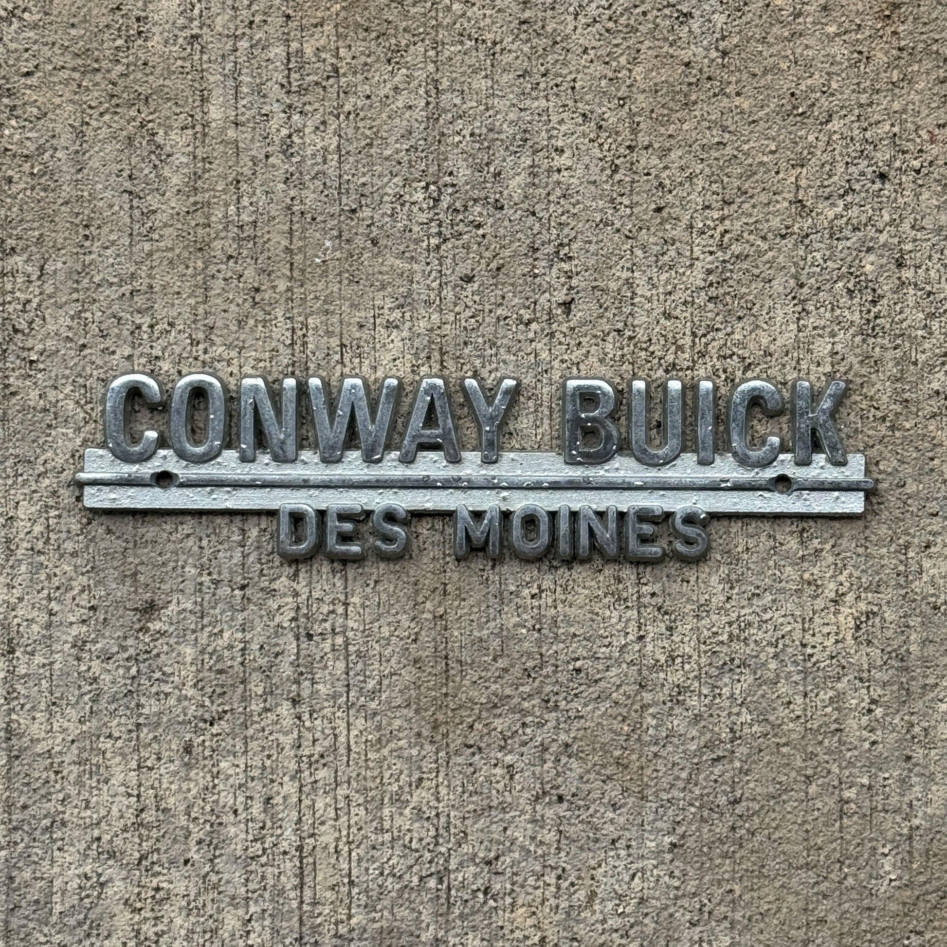 Photo of a 1960 Era Conway Buick Des Moines Iowa Dealer Badge Emblem Auto Tag Garage Decor Vintage Dealership with original patina