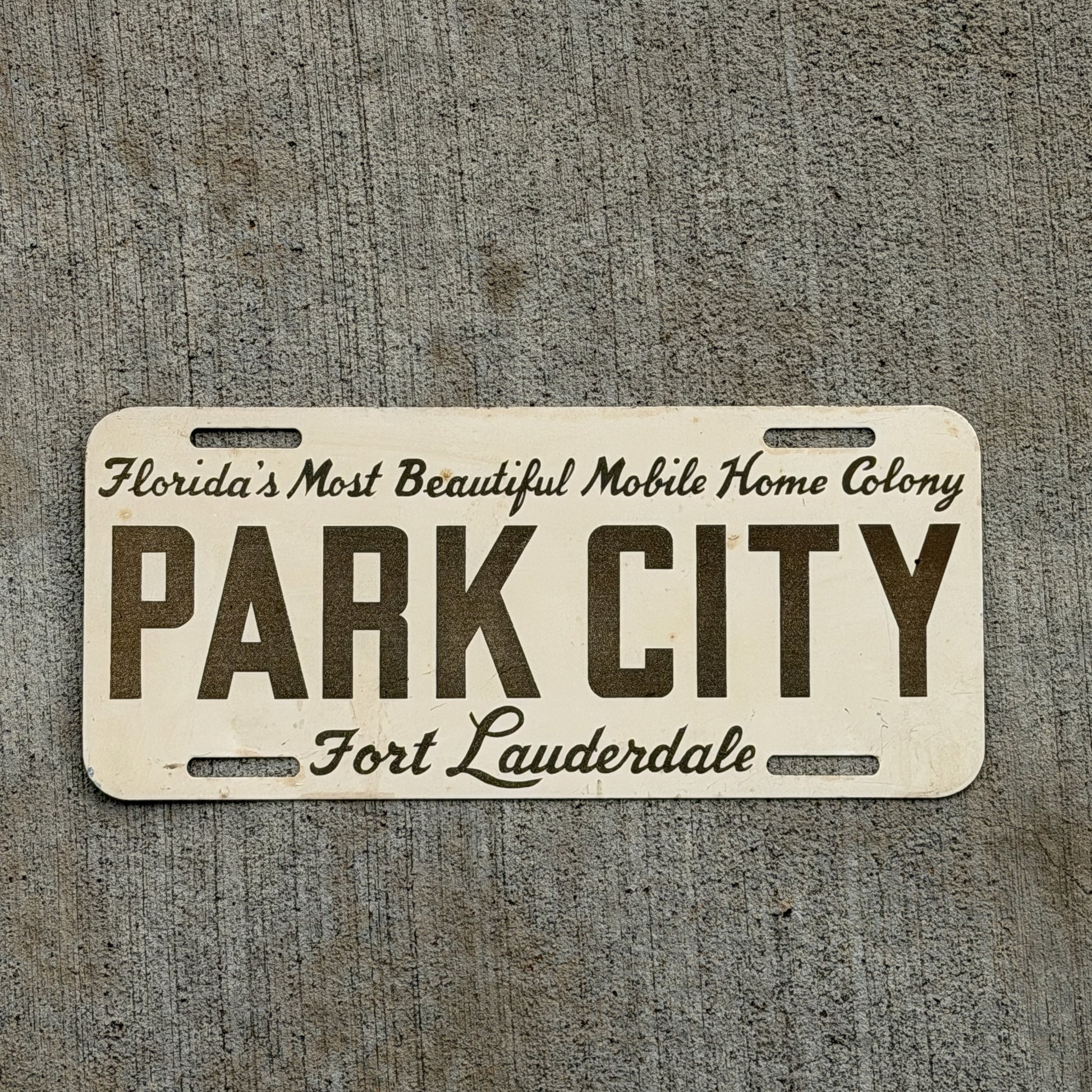 Photo of a 1960 Era Florida Booster License Plate Auto Tag Garage Decor Vintage Fort Lauderdale PARK CITY with original patina