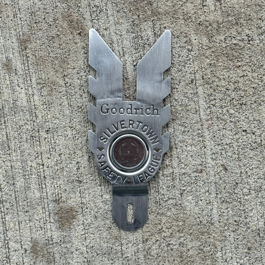 Photo of a 1960 Era Goodrich Silvertown Safety League License Plate Topper Auto Tag Garage Decor Vintage with original patina