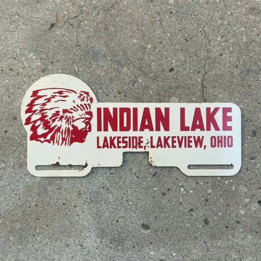 Photo of a 1960 Era Indian Lake Ohio License Plate Topper Auto Tag Garage Decor Vintage Lakeside Lakeview OH Graphic Chief with original patina