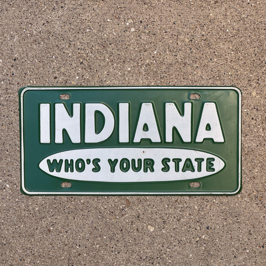Photo of a 1960 Era Indiana Booster License Plate Auto Tag Garage Decor Vintage Who's Your State Hoosier State with original patina