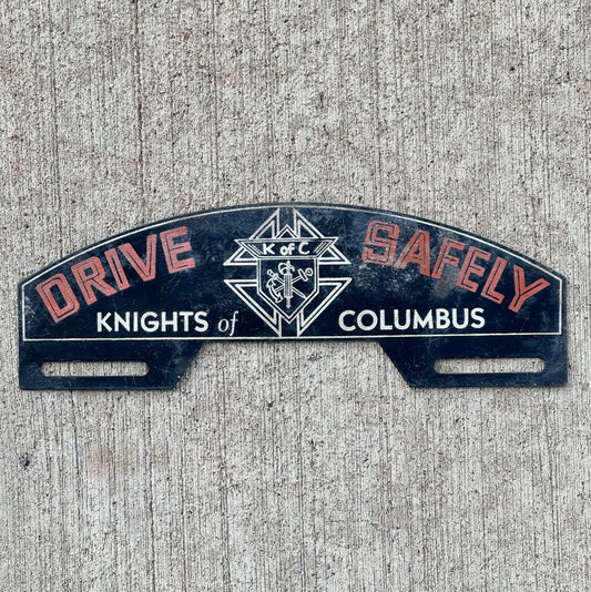 Photo of a 1960 Era Knights of Columbus License Plate Topper Auto Tag Garage Decor Vintage Fraternal Order Drive Safely with original patina