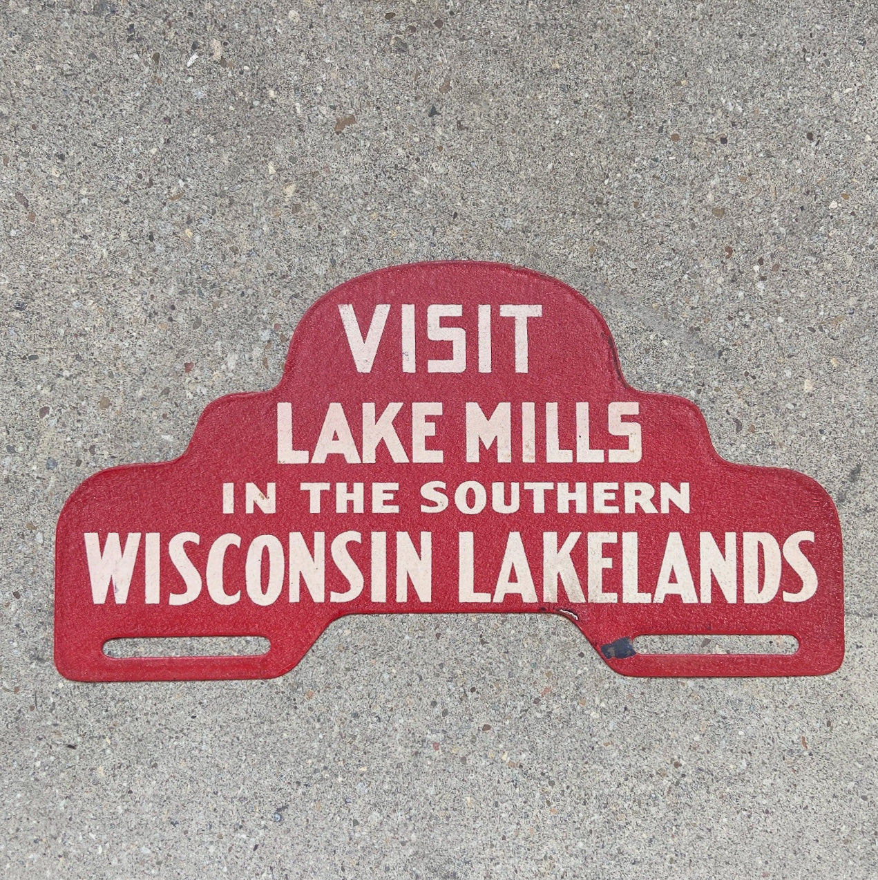 Photo of a 1960 Era Lake Mills Wisconsin License Plate Topper Auto Tag Garage Decor Vintage Lakelands Madison Milwaukee Wisc with original patina