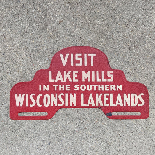 Photo of a 1960 Era Lake Mills Wisconsin License Plate Topper Auto Tag Garage Decor Vintage Lakelands Madison Milwaukee Wisc with original patina