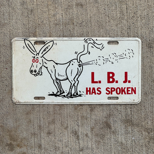 Photo of a 1960 Era LBJ Has Spoken Booster License Plate Auto Tag Garage Decor Vintage Political President Republican Ad with original patina