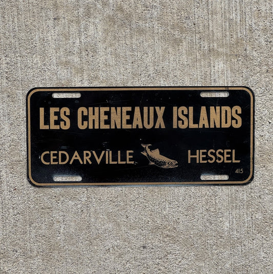 Photo of a 1960 Era Les Cheneaux Islands Michigan Booster License Plate Auto Tag Garage Decor Vintage Cedarville Fish with original patina