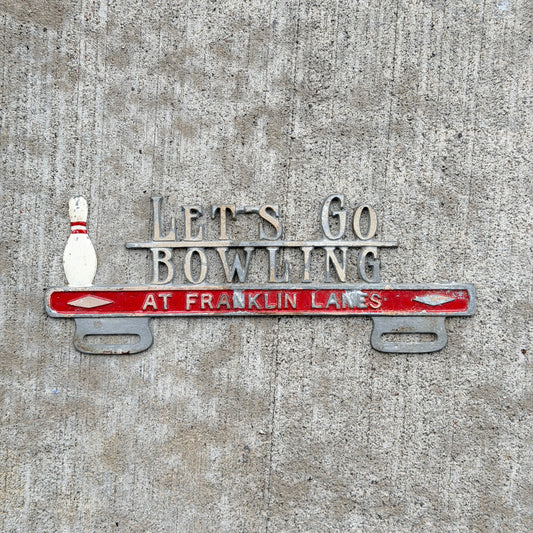 Photo of a 1960 Era Let's Go Bowling Franklin Lanes Evansville Indiana License Plate Topper Auto Tag Garage Decor Vintage Cast Aluminum Original with original patina