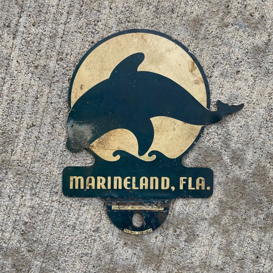 Photo of a 1960 Era Marineland Florida License Plate Topper Auto Tag Garage Decor Vintage Marine Land Dolphin Allentown PA with original patina