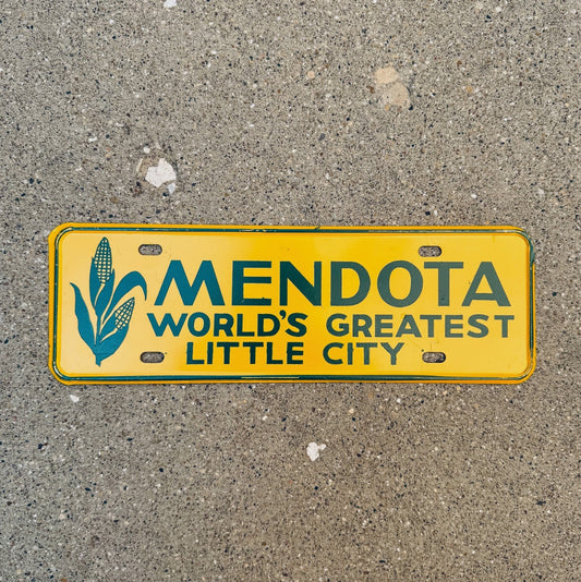 Photo of a 1960 Era Mendota Illinois License Plate Topper Auto Tag Garage Decor Vintage Corn Graphic Yellow Farm Farming with original patina