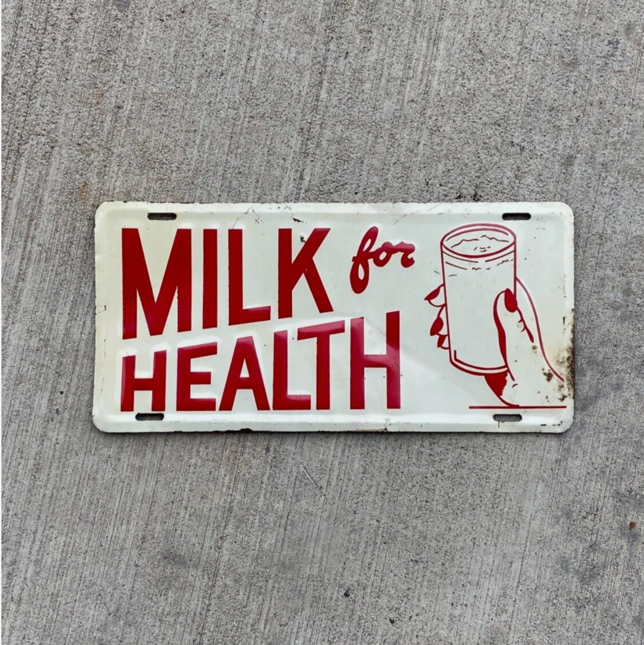 Photo of a 1960 Era Milk for Health Booster License Plate Auto Tag Garage Decor Vintage Kitchen Decor Dairy with original patina