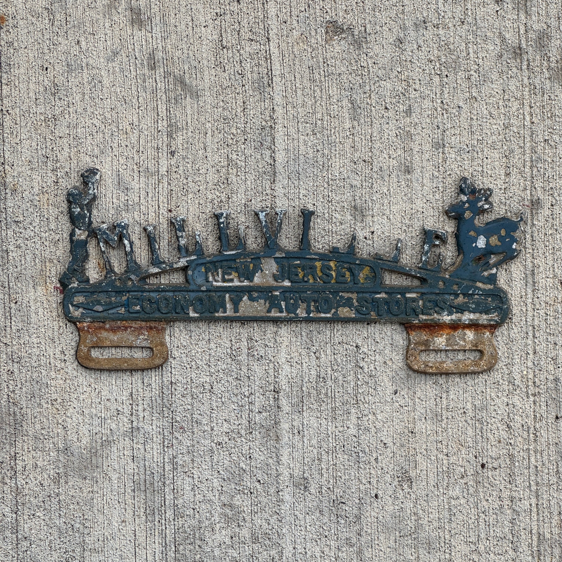 Photo of a 1960 Era Millville New Jersey License Plate Topper Auto Tag Garage Decor Vintage Economy Auto Stores with original patina