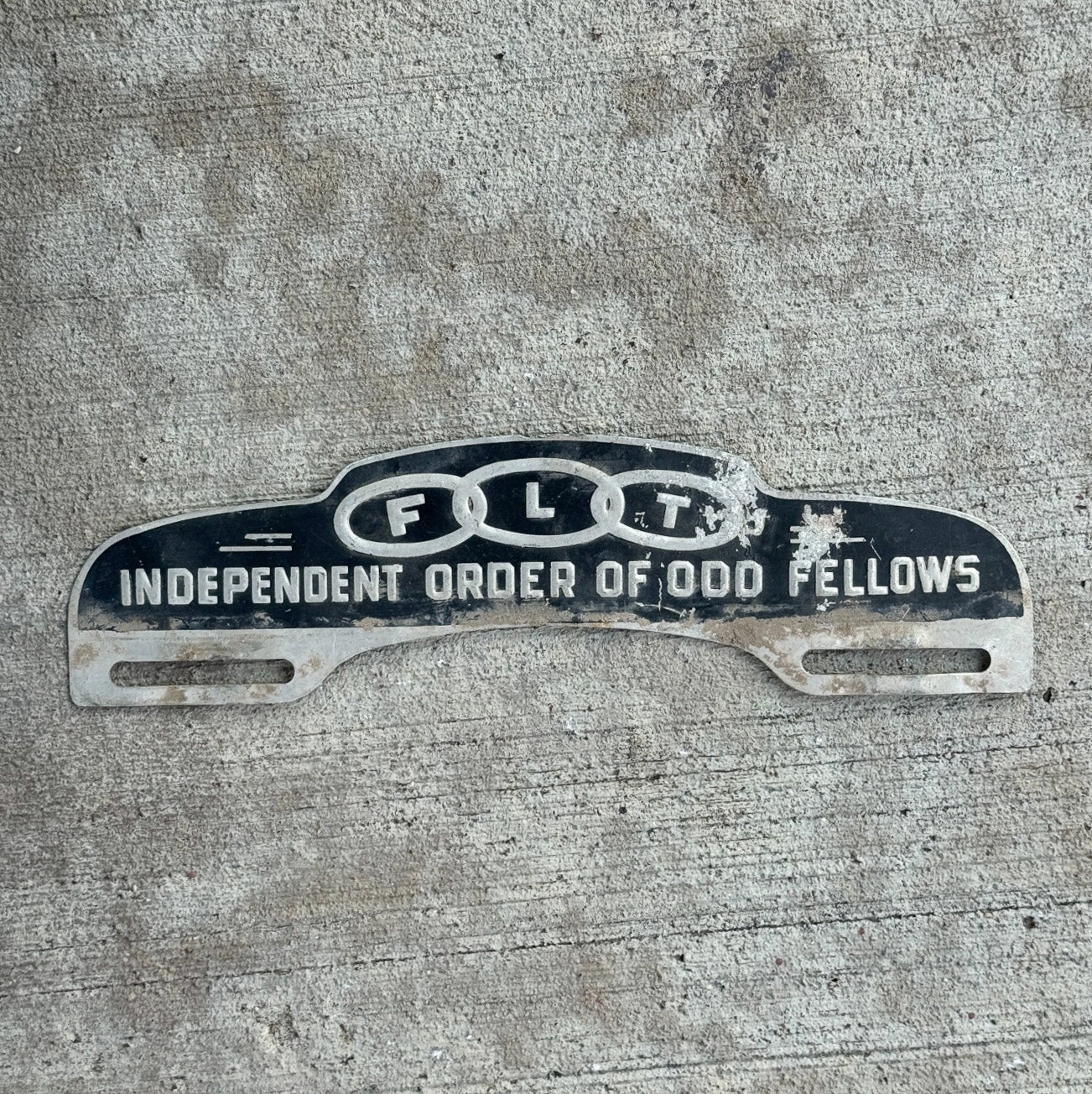 Photo of a 1960 Era Odd Fellows License Plate Topper Auto Tag Garage Decor Vintage Vintage Fraternal Order IOOF FLT with original patina