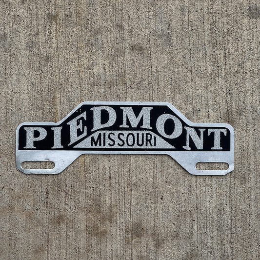 Photo of a 1960 Era Piedmont Missouri License Plate Topper Auto Tag Garage Decor Vintage Smaltz Reflective Paint with original patina