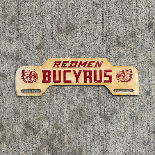 Photo of a 1960 Era Redmen Bucyrus Ohio License Plate Topper Auto Tag Garage Decor Vintage High School with original patina
