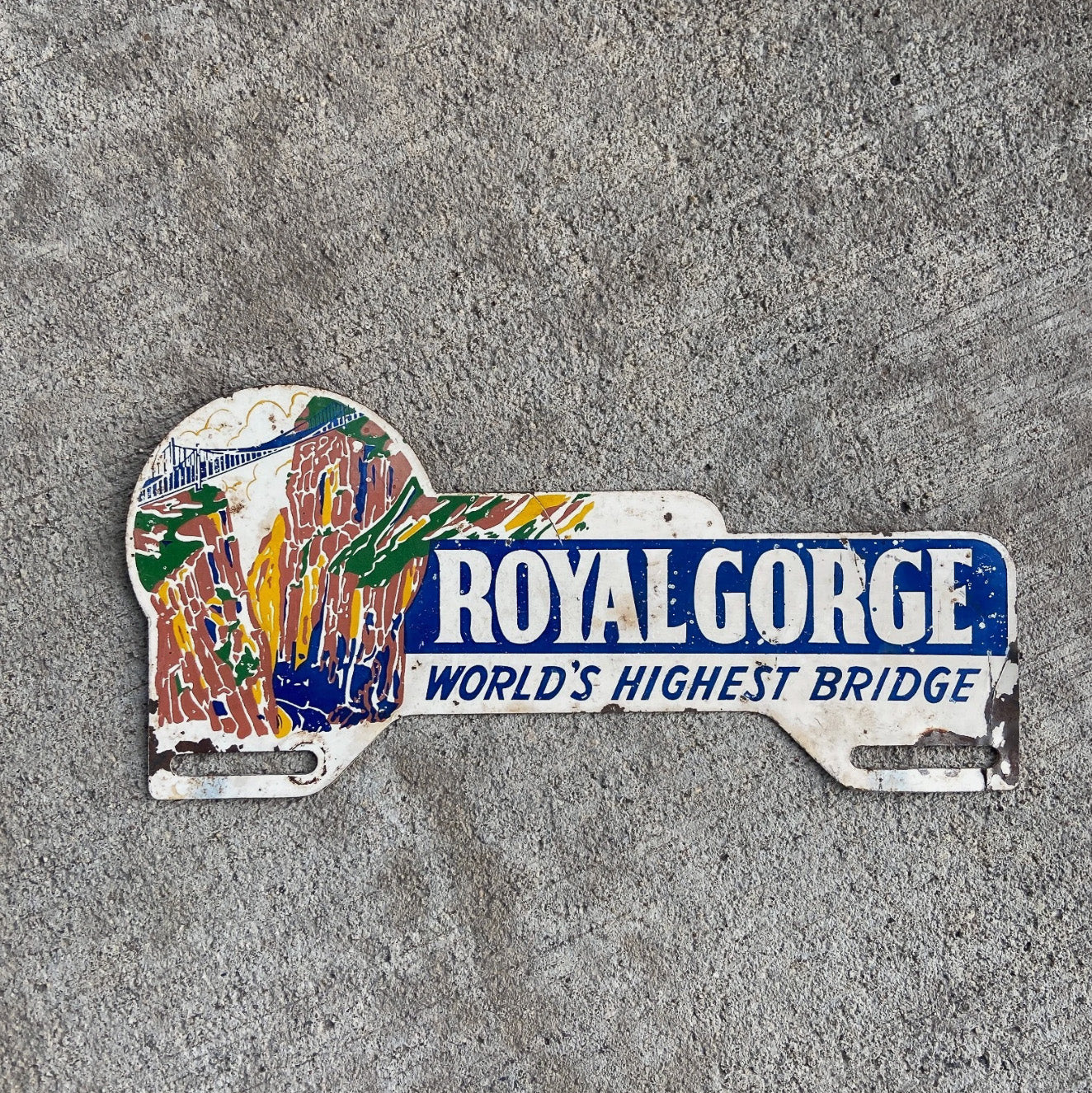 Photo of a 1960 Era Royal Gorge Colorado License Plate Topper Auto Tag Garage Decor Vintage Rocky Mountains Cañon City Colo with original patina