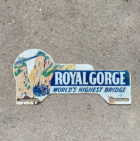 Photo of a 1960 Era Royal Gorge Colorado License Plate Topper Auto Tag Garage Decor Vintage Rocky Mountains Cañon City Colo with original patina