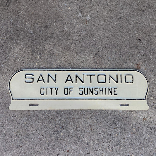 Photo of a 1960 Era San Antonio Texas License Plate Topper Auto Tag Garage Decor Vintage TX City of Sunshine Southern with original patina
