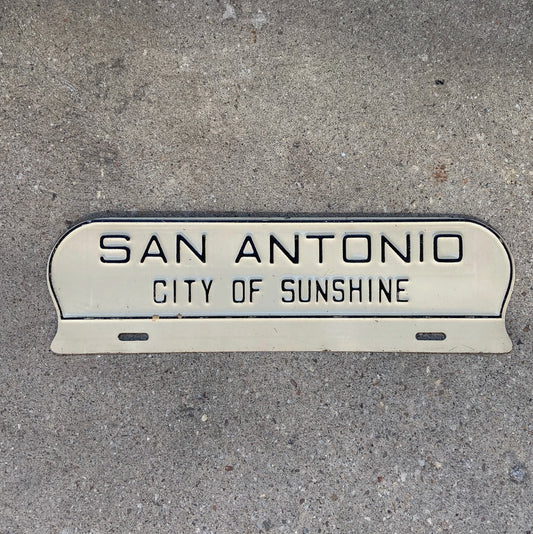 Photo of a 1960 Era San Antonio Texas License Plate Topper Auto Tag Garage Decor Vintage TX City of Sunshine Southern with original patina