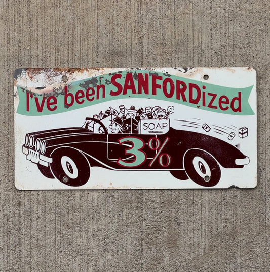 Photo of a 1960 Era Sanfordized Car Soap Booster License Plate Auto Tag Garage Decor Vintage Bathroom Decor with original patina