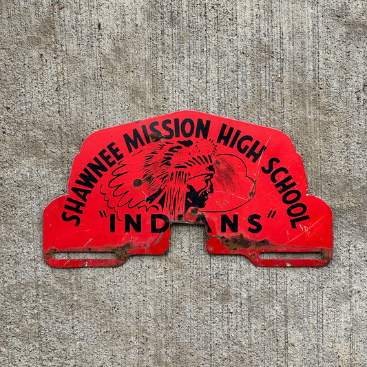 Photo of a 1960 Era Shawnee Mission High School Kansas License Plate Topper Auto Tag Garage Decor Vintage Native American Graphic with original patina