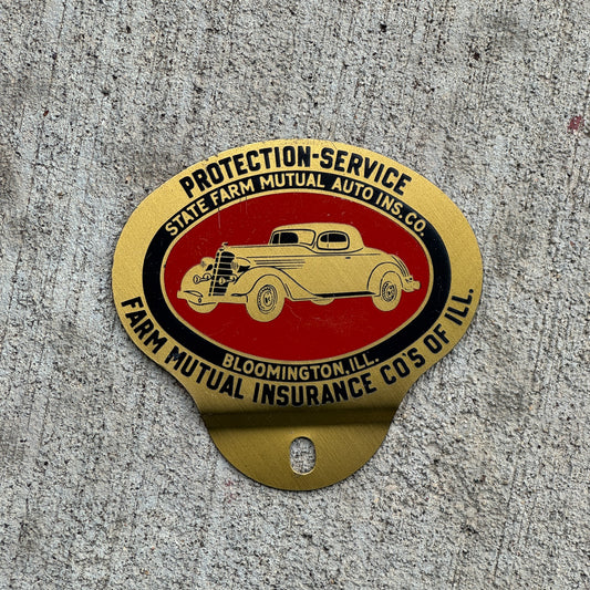 Photo of a 1960 Era State Farm Auto Insurance Badge Illinois License Plate Topper Auto Tag Garage Decor Vintage Farm Bureau Federation with original patina
