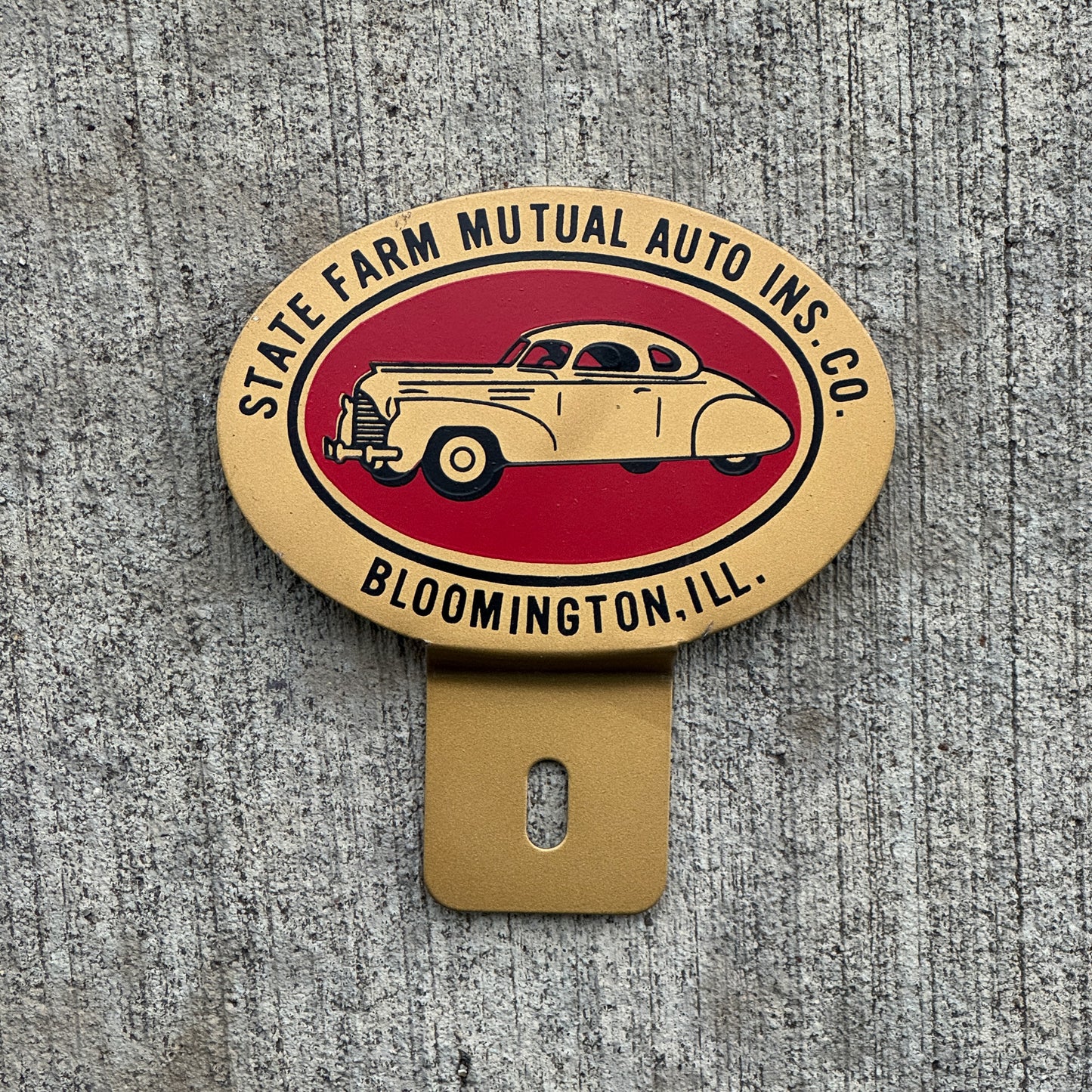 Photo of a 1960 Era State Farm Mutual Auto Insurance Bloomington Illinois License Plate Topper Auto Tag Garage Decor Vintage with original patina