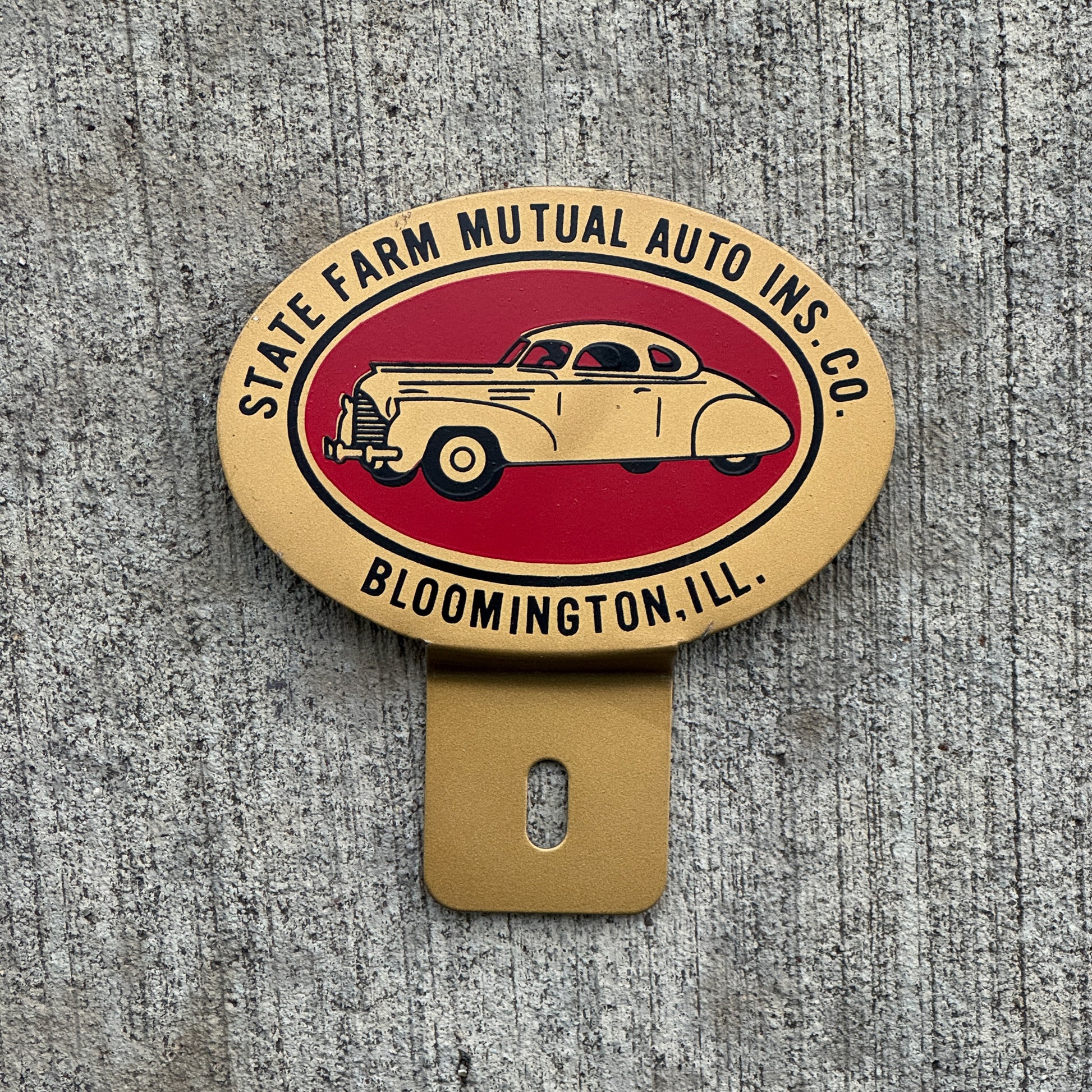 Photo of a 1960 Era State Farm Mutual Auto Insurance Bloomington Illinois License Plate Topper Auto Tag Garage Decor Vintage with original patina